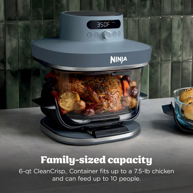 Roast chicken cooking in the large glass container