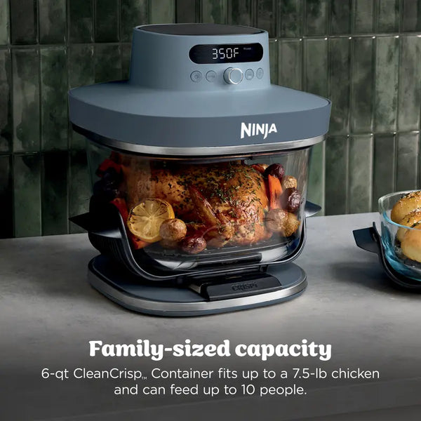 Roast chicken cooking in the large glass container