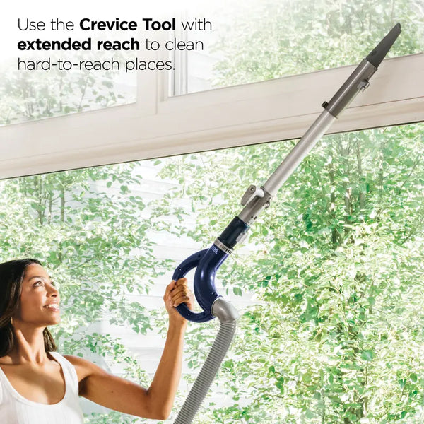 Crevice tool reaching above a window